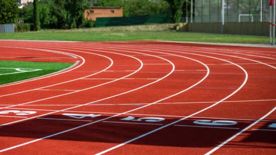 Red treadmill at the stadium with the numbering